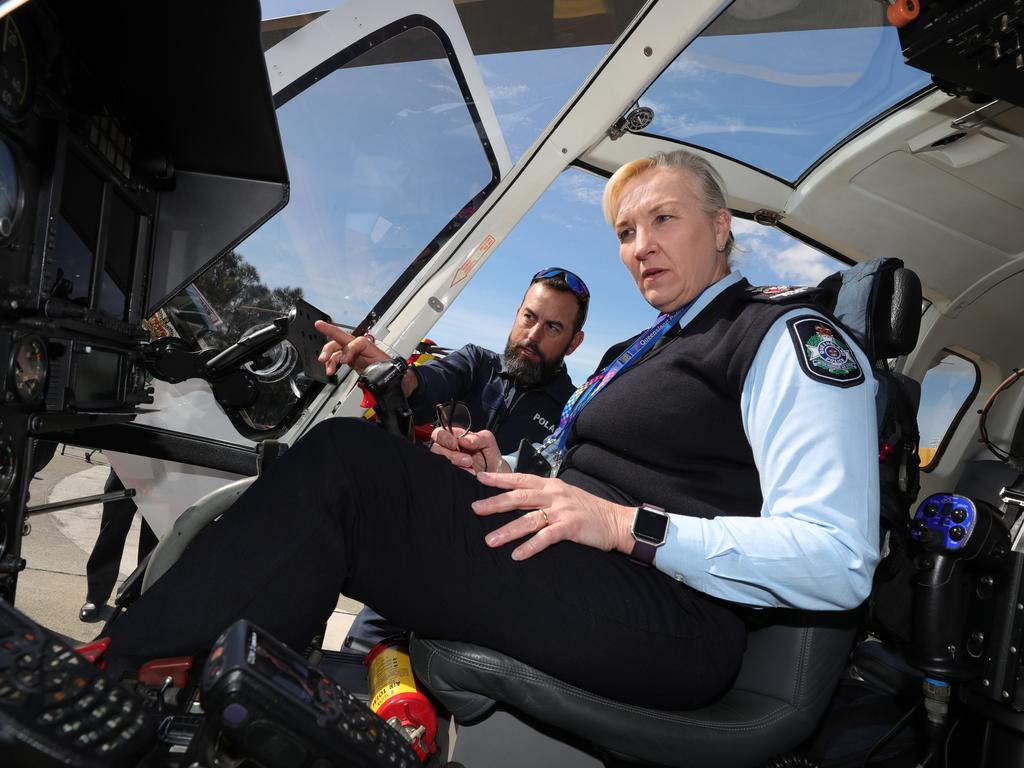 Ms Carroll talks to police air pilot Shannon Kurz. Picture: Glenn Hampson