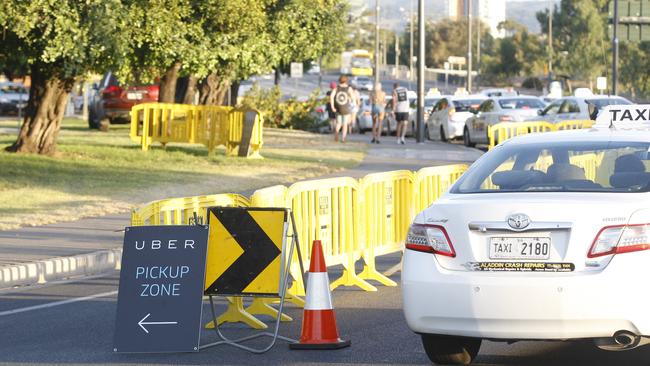 A taxi passes a designated Uber Pick Up zone during the Stereosonic Music Festival at Bonython Park.