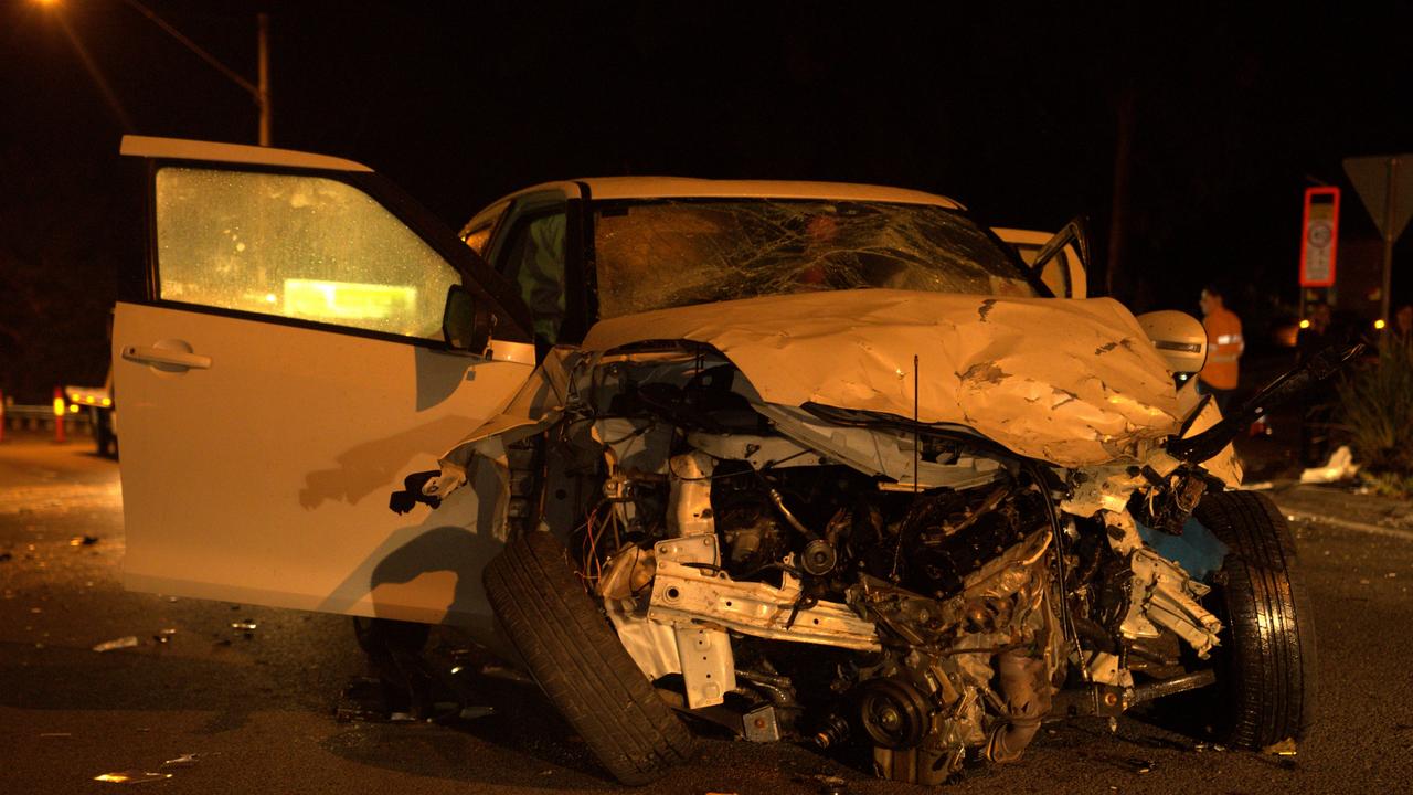 The white Suzuki Swift in the aftermath of a serious crash in Woombye.