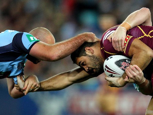 State of Origin II, 2012: NSW forward Glenn Stewart gets to grips with Greg Inglis.