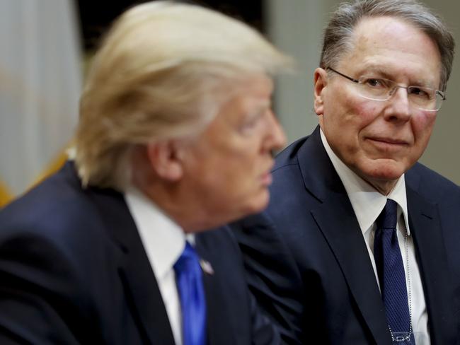 National Rifle Associations (NRA) Executive Vice President and Chief Executive Officer Wayne LaPierre listens to US President Donald Trump. Picture: AP