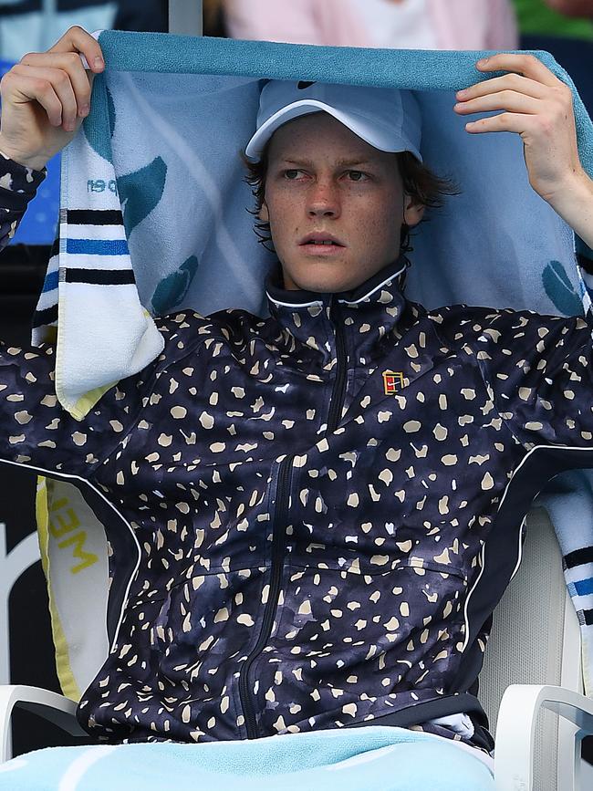 Italy’s Jannik Sinner takes shelter during his match against Australian qualifier Max Purcell. Picture: Getty Images