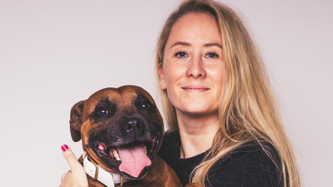 Calley Gibson with her rescue dog Pikelet who inspired her work.