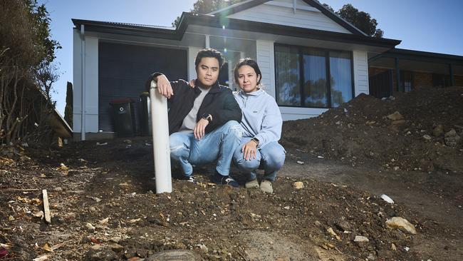 Gian David with his partner, Rizelle Fontelar at home in Woodcroft in their unfinished driveway. Picture: Matt Loxton