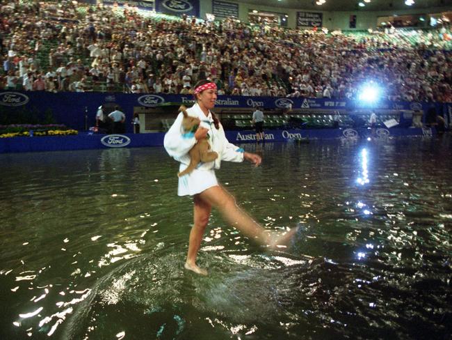 Natasha Zvereva takes a splash at a flooded Melbourne Park during the 1995 Australian Open.