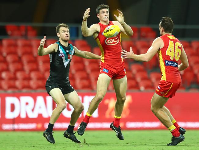 Sam Collins of the Suns in action during the round 1 AFL match between the Gold Coast Suns and the Port Adelaide Power at Metricon Stadium on March 21, 2020 in Gold Coast, Australia. (Photo by Chris Hyde/Getty Images)