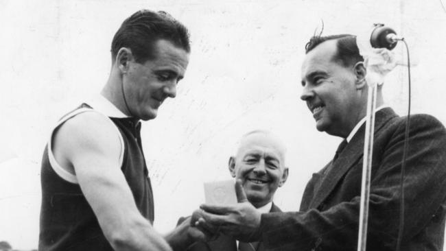 Jim Deane presented with the 1953 Magarey Medal.