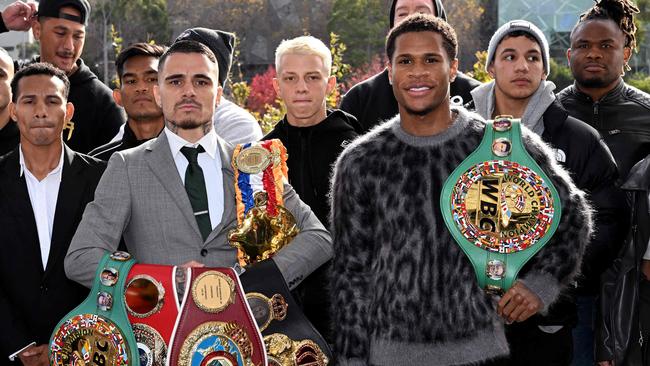 Kambosos and Haney with the many belts which are up for grabs on Sunday. Picture: AFP