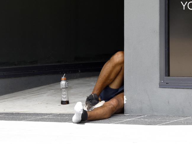 A homeless man lies on a street in Surfers Paradise. Picture: Tertius Pickard.