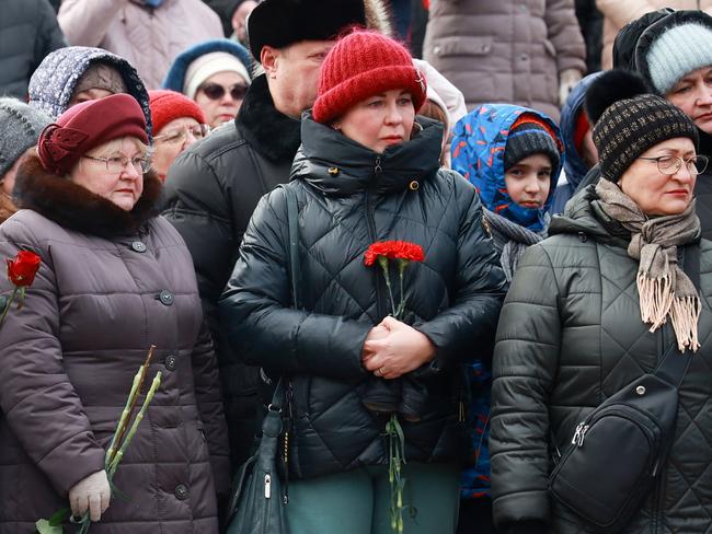 Mourners gather to lay flowers in memory of more than 60 Russian soldiers that Russia says were killed in a Ukrainian strike on Russian-controlled territory, in Samara, on January 3, 2023. Picture: Arden Arkman / AFP.