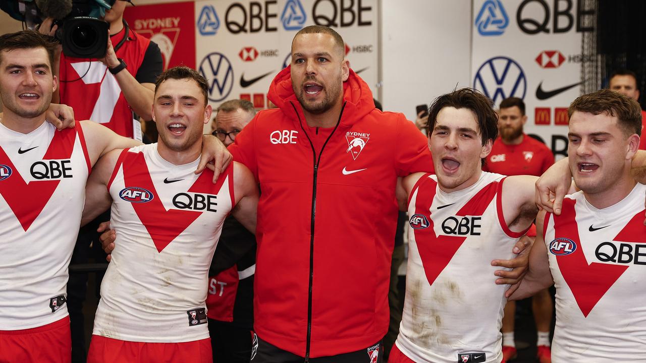 Lance Franklin of the Swans sings the team song with teammates. Photo by Daniel Pockett/Getty Images.