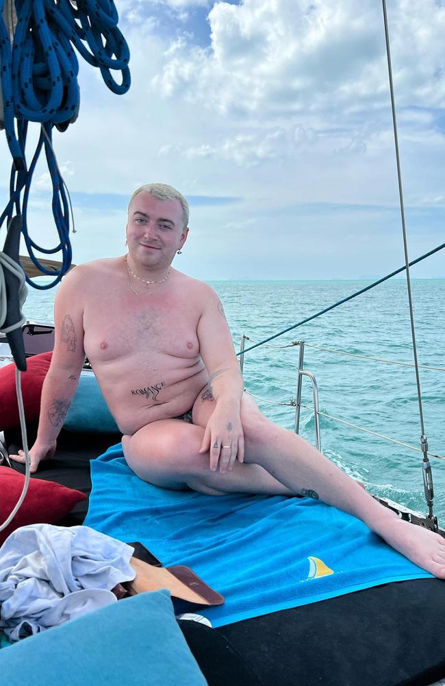 Smith was all smiles as they posed on a yacht.