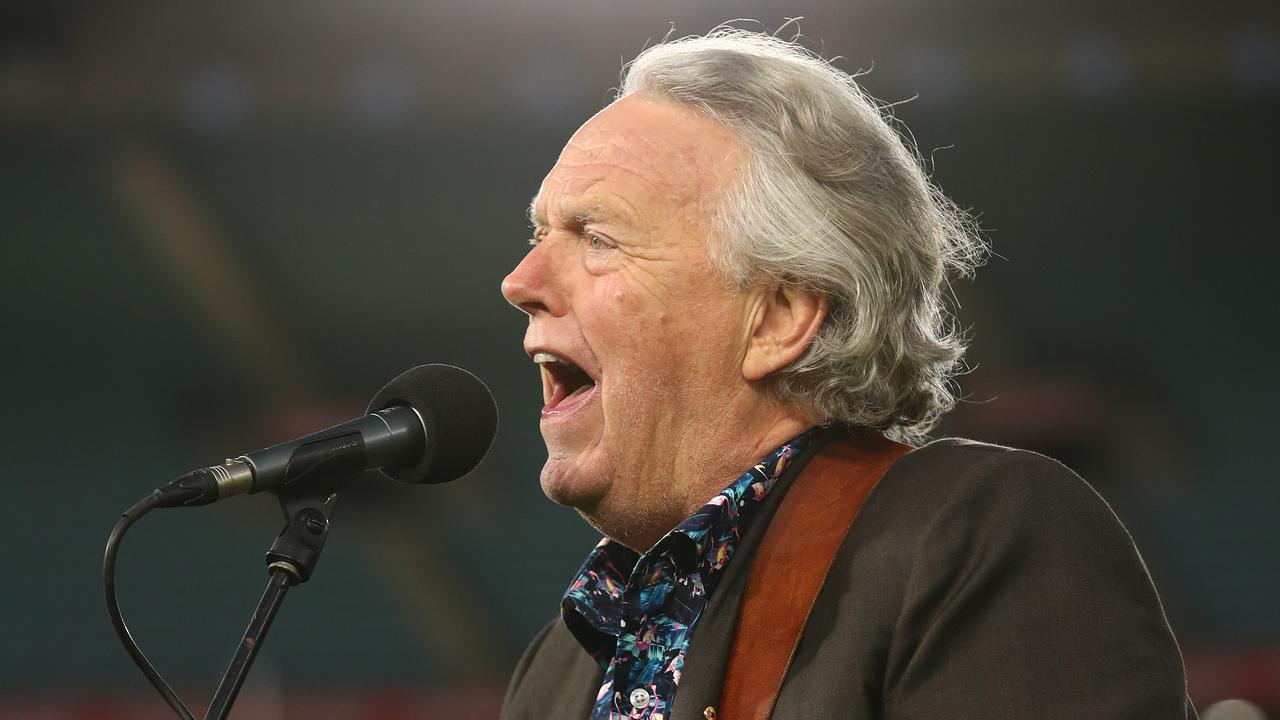 Mike Brady performs as part of the AFL Grand Final entertainment.