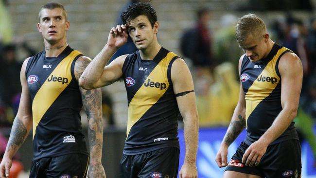 AFL Round 4 - Richmond v Melbourne at MCG , Dustin Martin, Trent Cotchin and Brandon Ellis walk off after the loss. 24th April 2015. Picture: Colleen Petch.