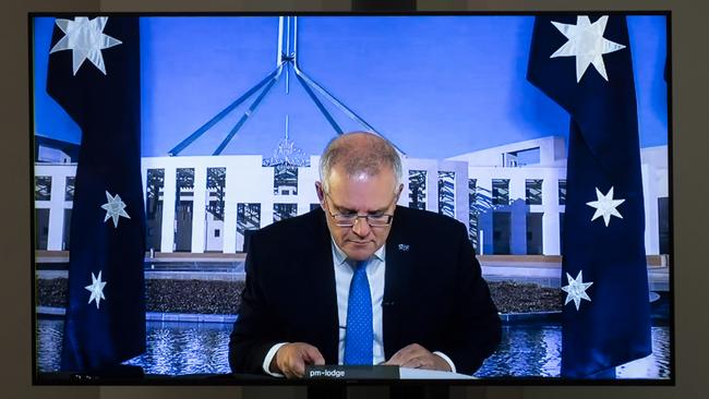 Scott Morrison spent most question time on mute, head down in his phone. Picture: Martin Ollman