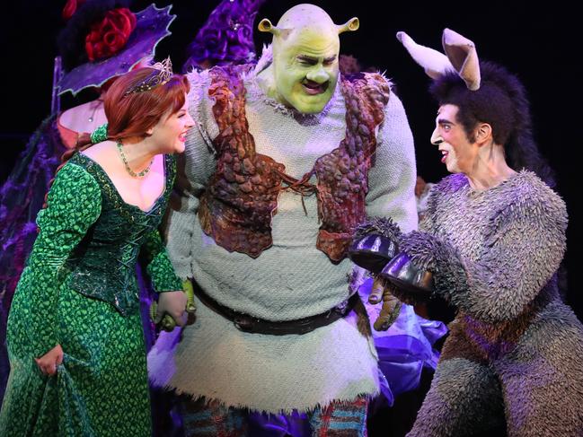 Lucy Durack as Princess Fiona, Ben Mingay as Shrek and Nat Jobe as Donkey during a media call for 'Shrek The Musical' at Her Majesty's Theatre in Melbourne, Wednesday, February 19, 2020. (AAP Image/David Crosling) NO ARCHIVING