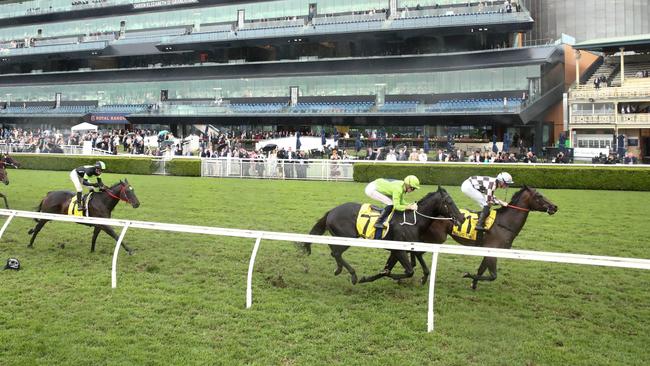 Magic Time runs down Amenable to win the All Aged Stakes. Picture: Jason McCawley/Getty Images