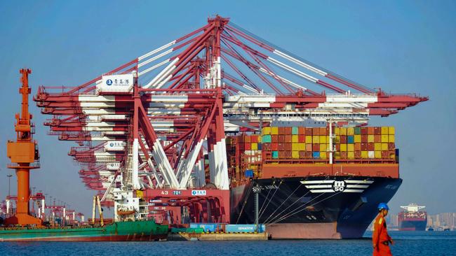 A container ship docked at Qingdao in China's eastern Shandong province yesterday. Picture: AFP