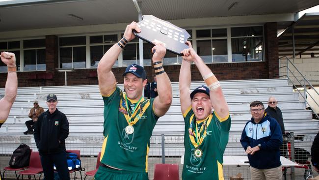 Cudgen captain Caleb Ziebell (left) lifting the premiership trophy. Photo: Elise Derwin