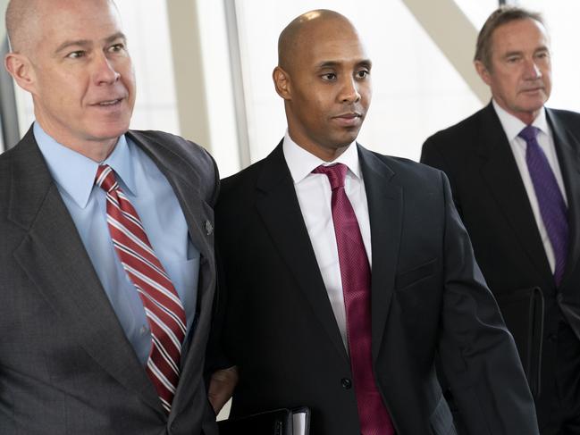 Former Minneapolis police officer Mohamed Noor, centre, leaves the Hennepin County Government Center after the first day of jury selection with his lawyers Thomas Plunkett, left, and Peter Wold, in Minneapolis. Picture: AP