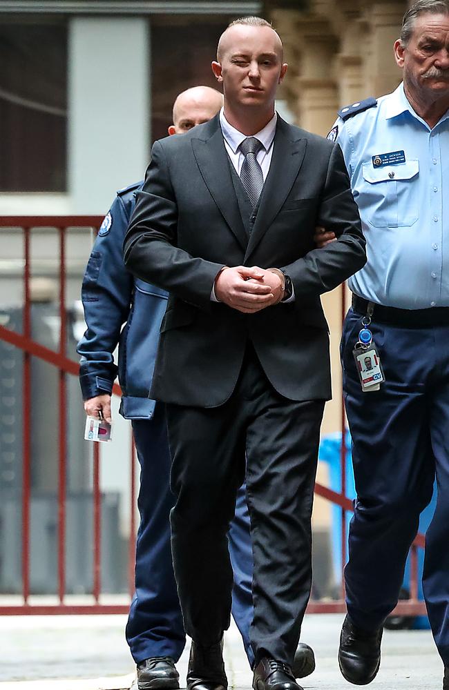 Brayden Smart winks at the media as he is led into Supreme Court. Picture: Ian Currie