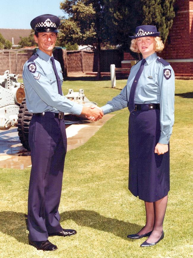 Police Academy course mentor John Schulz congratulates a graduate. Picture: Supplied