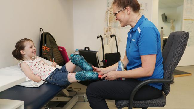 Mia Wilkinson has her new legs fitted. Picture: Peter Wallis