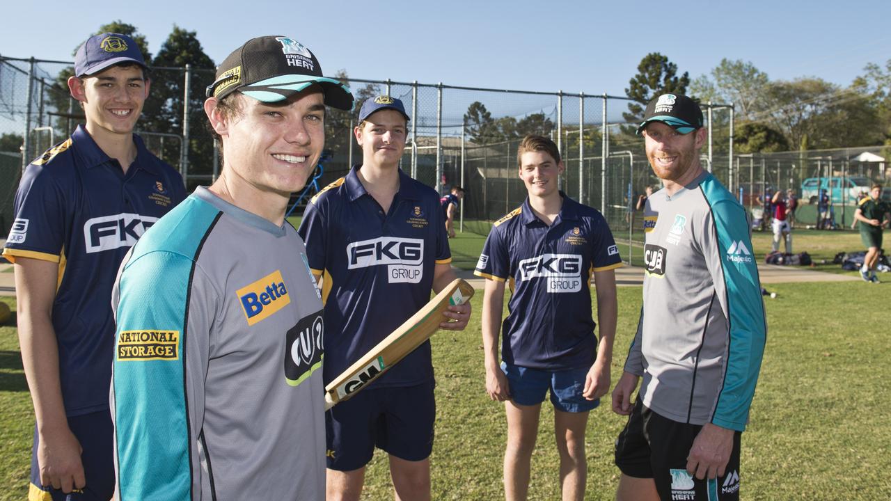 Samson Ryan, left, with Queensland Bulls players Sam Heazlatt (front) and Jason Floros and First XI team mates in 2017.