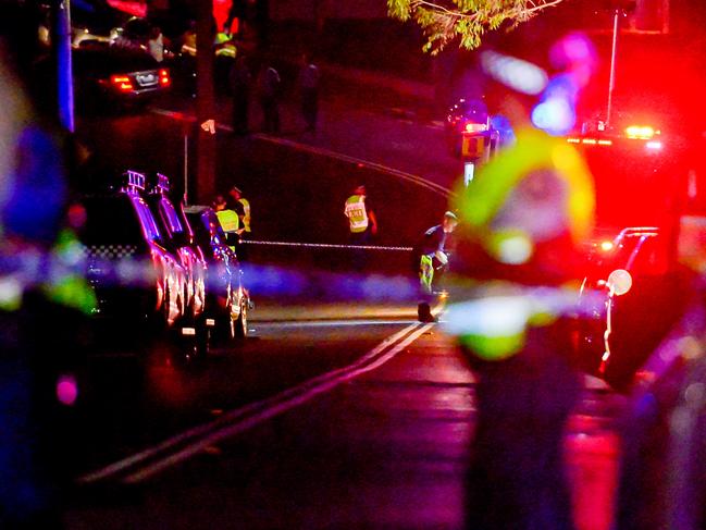 Ambulance, Police and Fire Crews keep an eye over the scene and the bodies.