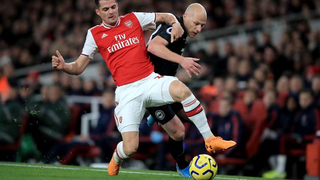 Brighton’s Aaron Mooy, right, battles Arsenal’s Granit Xhaka for possession at the Emirates Stadium. Picture: Getty Images