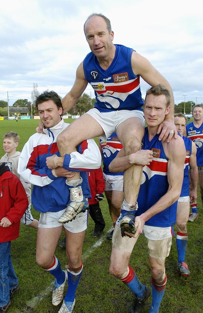 Simon Goosey is chaired off the ground by Chris Holcombe and Murray Peel in 2005. Picture: Chris Eastman 050820