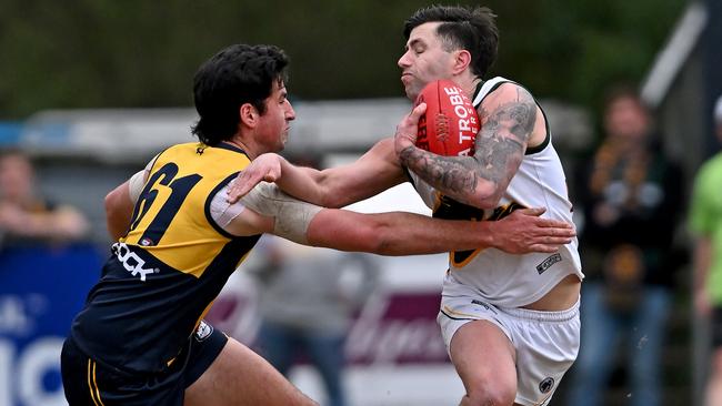 NFL: Hurstbridge’s Sunny Brazier tries to stop Ricky Fandrich of Northcote Park. Picture: Andy Brownbill