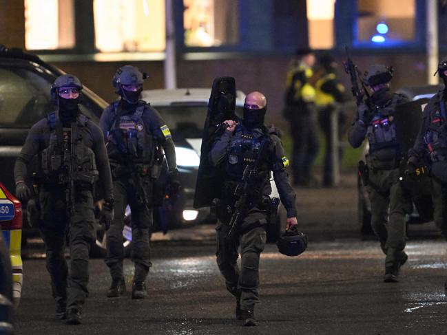 Police officers at the campus following the mass shooting. Picture: AFP