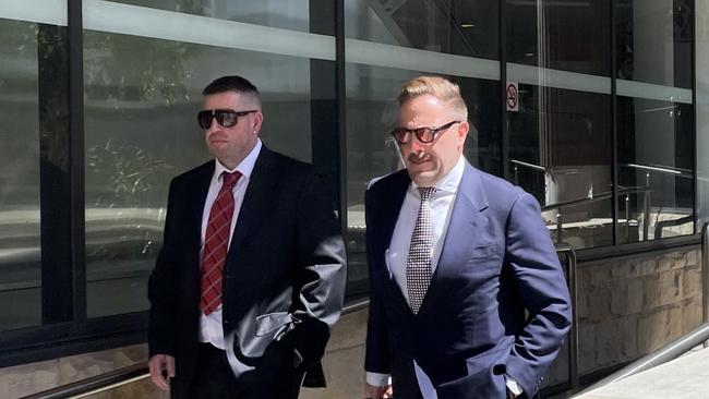 Joshua Toole, brother of former NSW Police Minister Paul Toole (left) leaving Newcastle court with his solicitor Drew Hamilton before he was jailed. Picture: Amy Ziniak