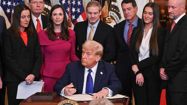 Donald Trump signs the Laken Riley Act in the East Room of the White House. Picture: AFP.