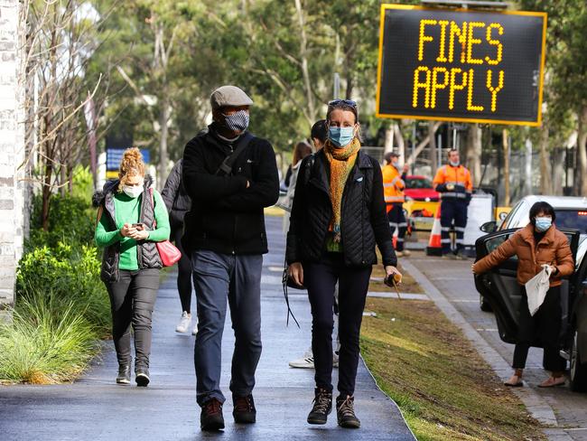 Locals Catherine Breen and Sathaporn Kamkong leave the Sydney vaccination hub after getting their Pfizer vaccine. Picture: NCA NewsWire / Gaye Gerard