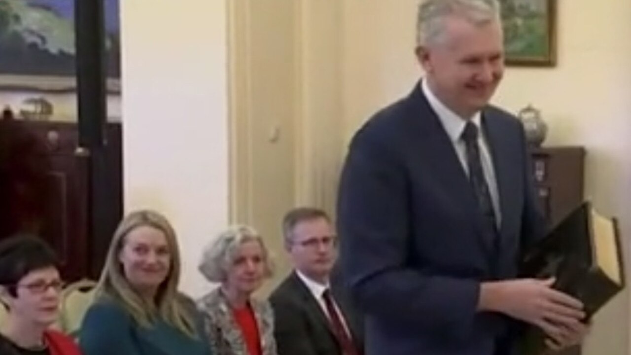 Jodie Haydon was captured giggling as Tony Burke entered with his huge bible. Picture: ABC
