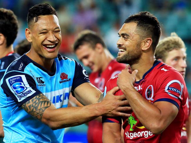 Waratahs star Israel Folau and Reds fullback Karmichael Hunt were all smiles after the clash earlier this season.