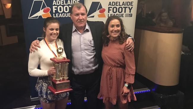 Adelaide University midfielder Stephanie Walker (L) after winning the 2019 Adelaide Footy League Women’s division one best and fairest medal with Blacks coach Mark Moody and teammate/runner up Matilda Zander. Picture: Supplied