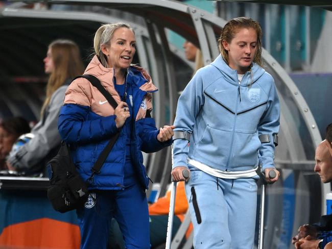 England's midfielder #04 Keira Walsh (R) walks with crutches after an injury. Picture: FRANCK FIFE / AFP.