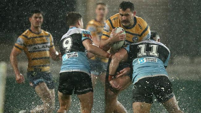 Reagan Campbell-Gillard tackled in the wet endurance test. Pic: Cameron Spencer/Getty Images.