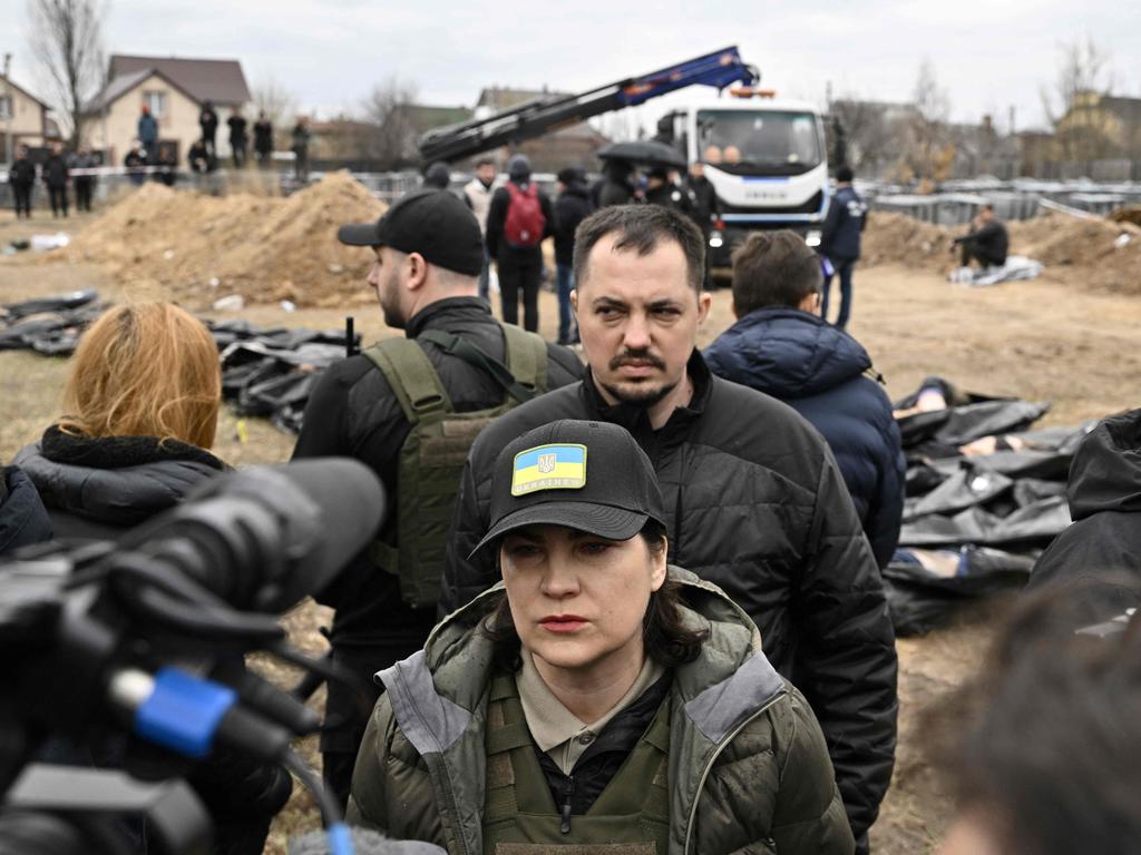 Ukraine's Prosecutor General Iryna Venediktova (C) addresses the media as she visits the site of a mass grave in the gardens of the St Andrew church in the town of Bucha. Picture: AFP