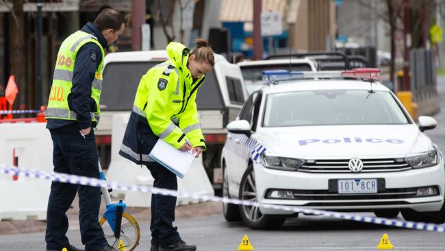 Police investigate the spot where the man and child were struck outside The Glen. Picture: Sarah Matray