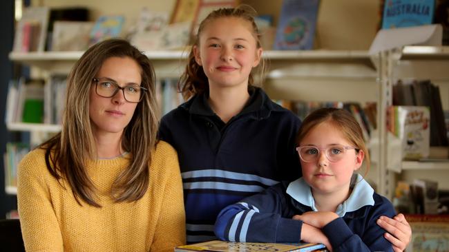 “It’s the heartbeat of the community,” says Sophie Bethune, with daughters Madalyn and Emma, who are in years 6 and 5 at St Brendan’s near Ballarat. Picture: Stuart McEvoy