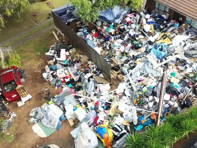 After desperate pleas from neighbours, authorities have moved in to clean up a serial hoarder house at Huntfield Heights. Picture: 7NEWS