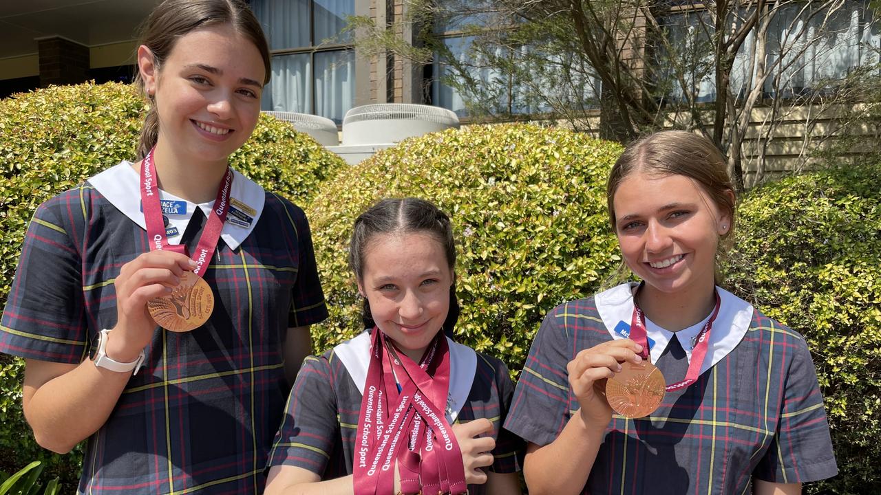 Fairholme College students (from left) Grace Vanzella, Taylah Chapman and Rose McLoughlin celebrate their success at the 13-19 Years Queensland School Sport Track &amp; Field Championships.