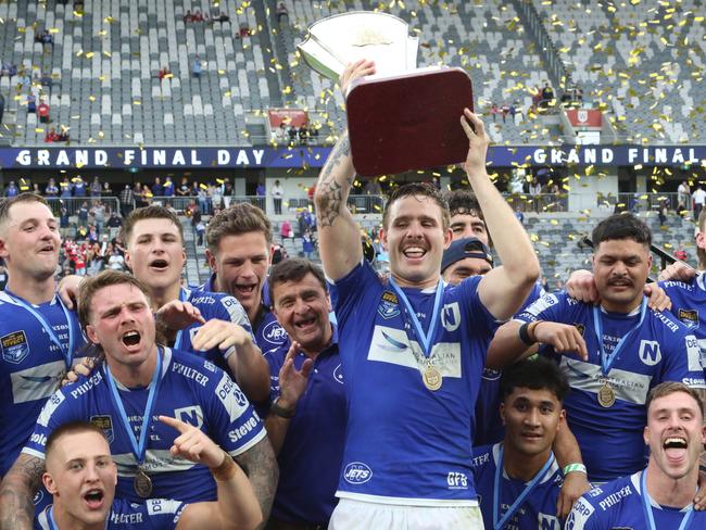 Newtown Jets captain Billy Burns hoists the NSW Cup after their 28-22 grand final win over North Sydney at CommBank Stadium on Sunday, September 29, 2024. Picture Warren Gannon Photography