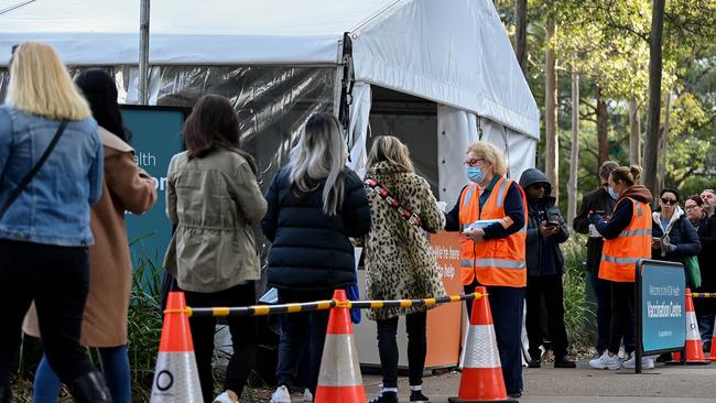 People line up to receive their COVID-19 vaccination at the NSW Health Vaccination hub in Sydney. Picture: NCA NewsWire/Bianca De Marchi