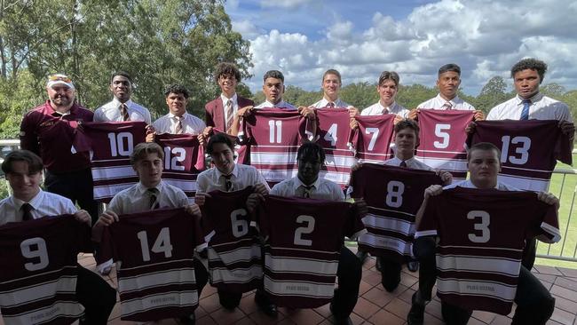 St Peters Lutheran College First XV rugby coach Russell Todd (back left) with his rugby team.