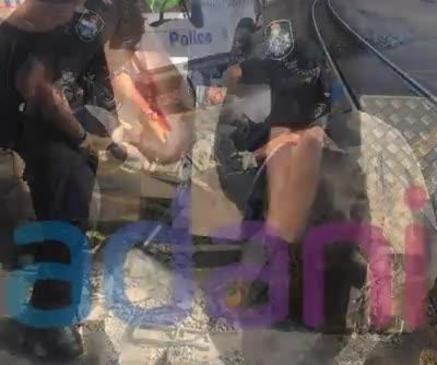 Police officer injured in anti-Adani stunt